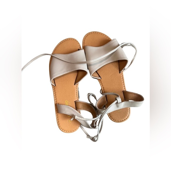 Shoes - NWOT Nude Flat Tie Up Sandals